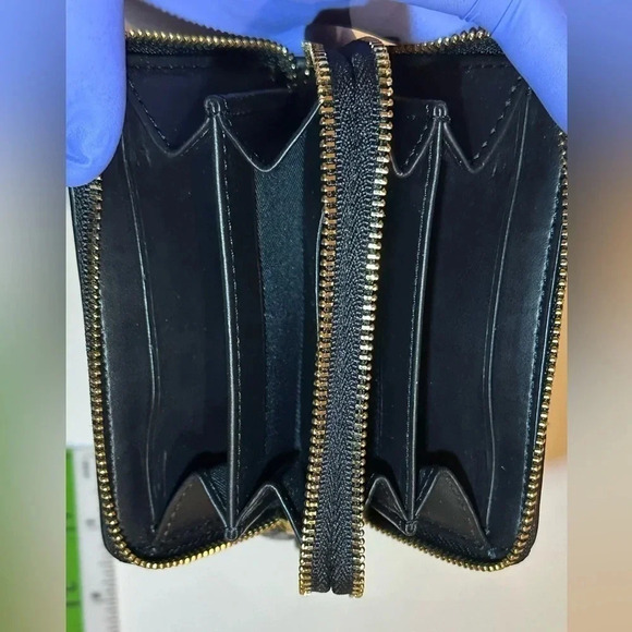 A Coach zip around mini sig. canvas wallet. - Picture 8 of 9